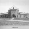 <p><strong>Romanesque Revival</strong>: Barracks (Building 69; built 1888), view northeast, ca. 1893.</p>